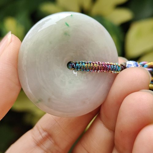 a hand holding a round object