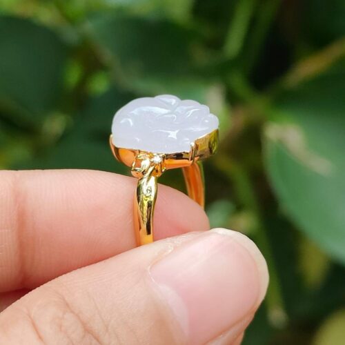 a hand holding a ring