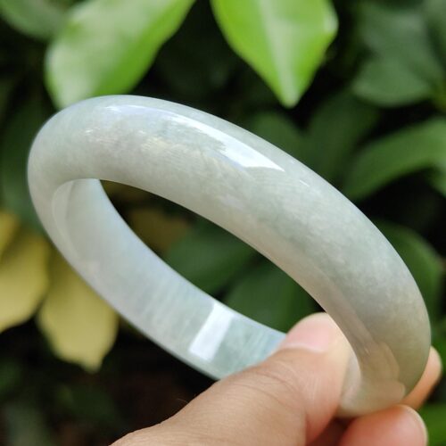 a hand holding a bracelet