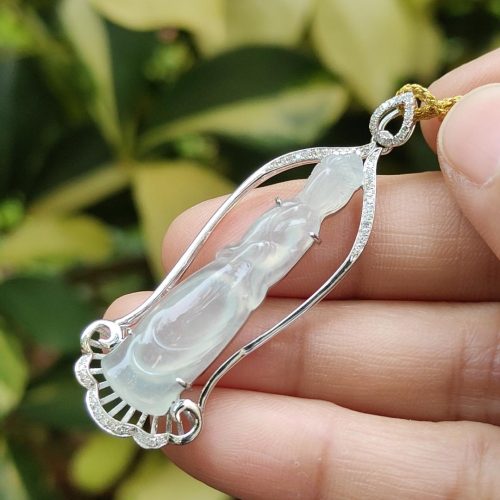 a hand holding a necklace