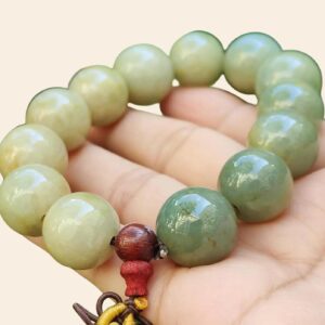 a hand holding a bracelet