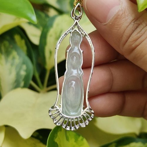 a hand holding a necklace