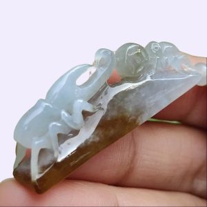 a hand holding a stone object