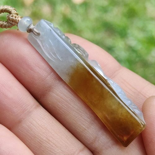 a hand holding a necklace