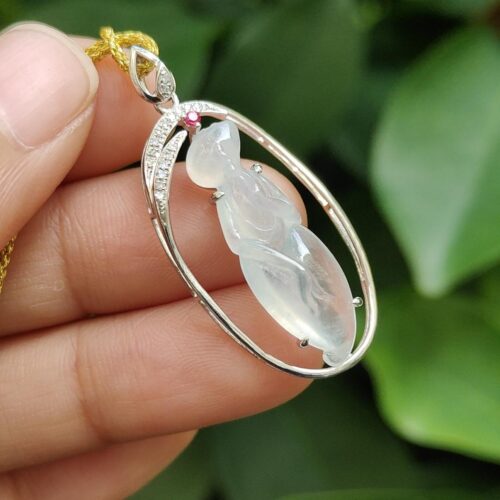 a hand holding a necklace