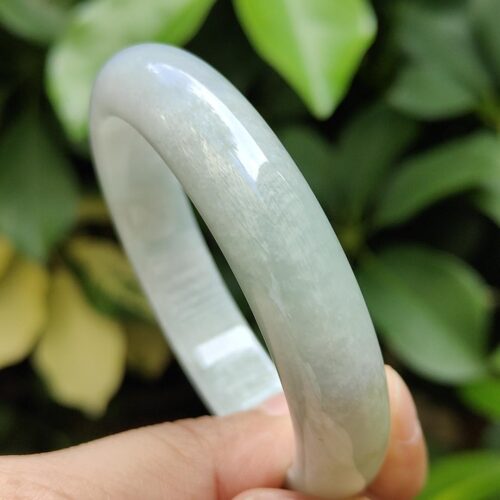 a hand holding a bracelet