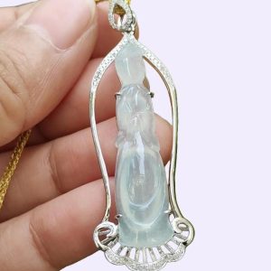 a hand holding a necklace