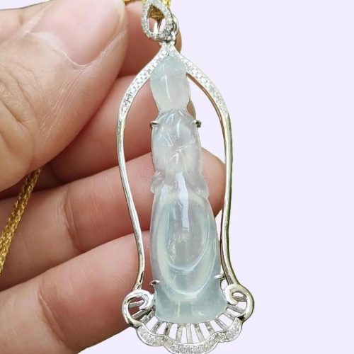 a hand holding a necklace