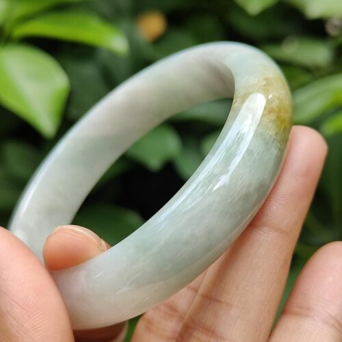 a hand holding a bracelet