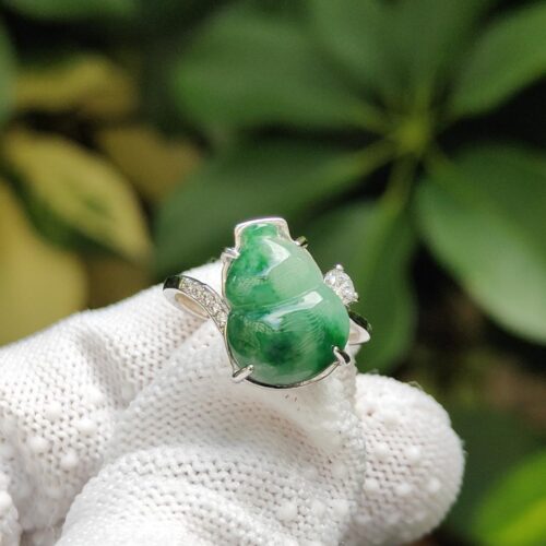 a ring on a gloved hand