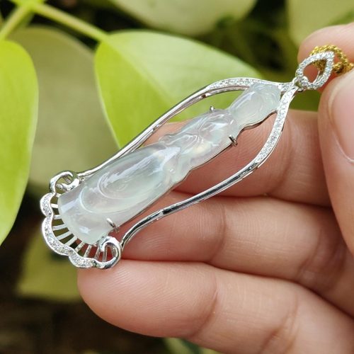 a hand holding a necklace