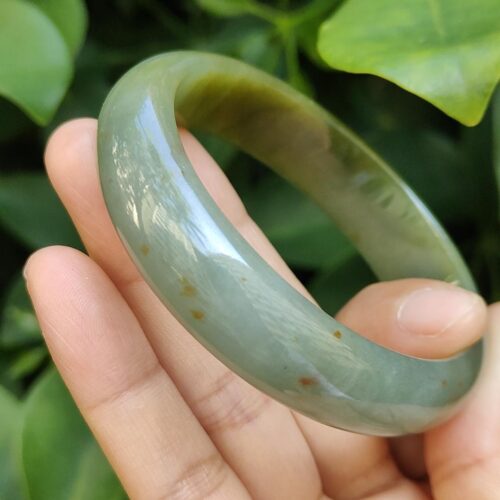 a hand holding a bracelet