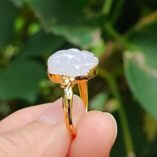 a hand holding a ring