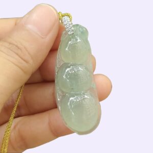 a hand holding a necklace