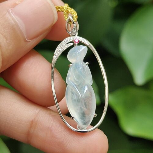 a hand holding a necklace