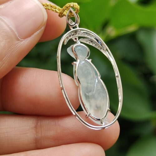 a hand holding a necklace