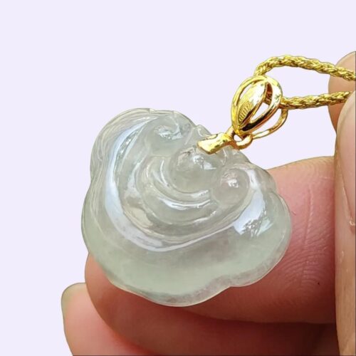 a hand holding a necklace