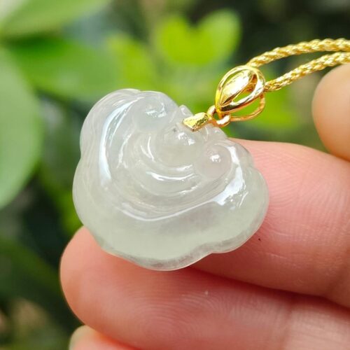 a hand holding a necklace