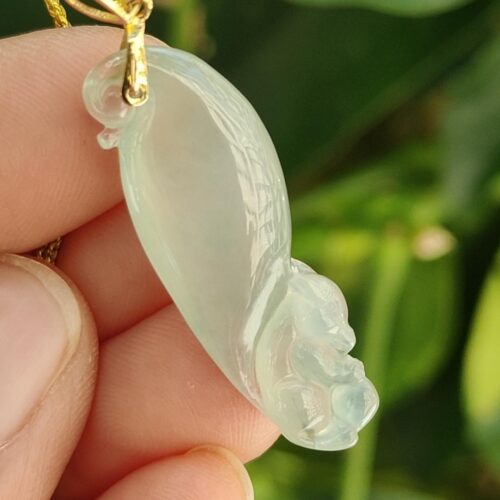 a hand holding a jade pendant - Squirrel Premium Quality with 18k Gold Clasp