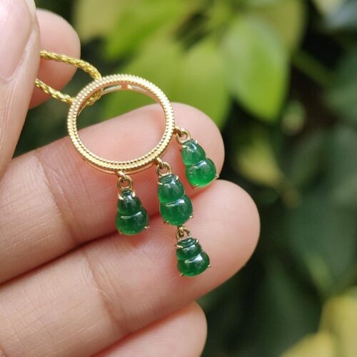 a hand holding a necklace