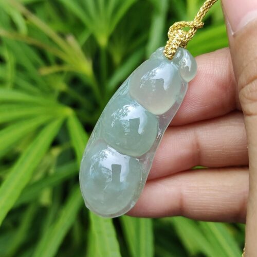 a hand holding a necklace