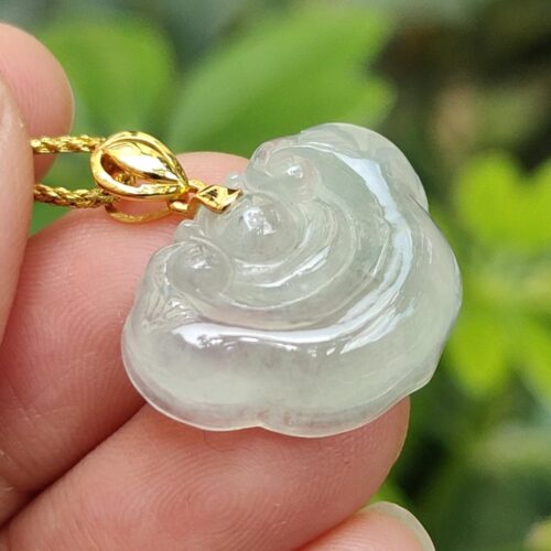 a hand holding a necklace