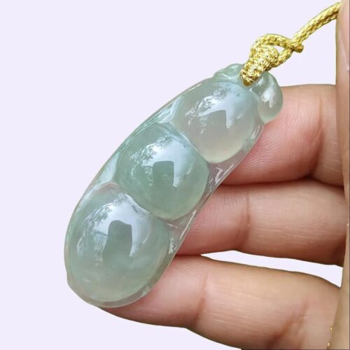 a hand holding a necklace