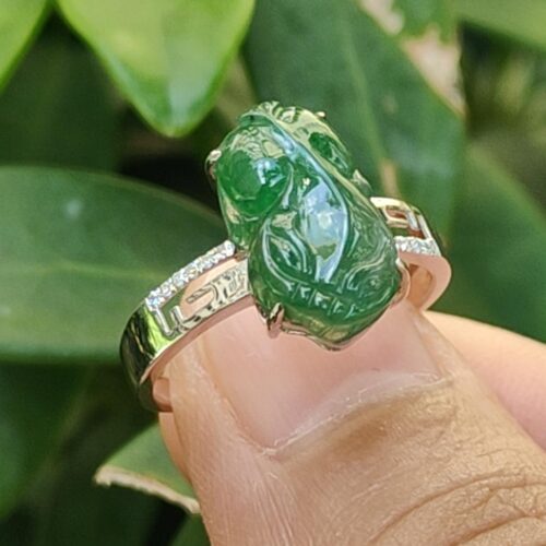 a finger with a ring on it - Green Pixiu Ring