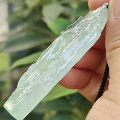 a hand holding a necklace