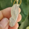 a hand holding a jade pendant - Squirrel Premium Quality with 18k Gold Clasp