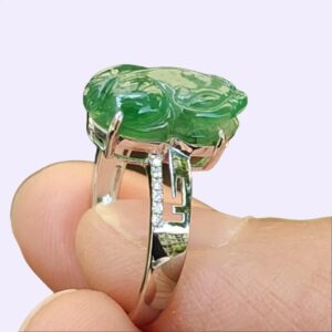 a person holding a ring - Green Pixiu Ring