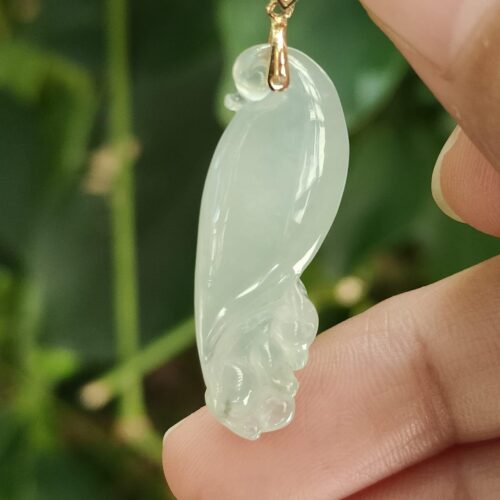 a hand holding a jade pendant - Squirrel Premium Quality with 18k Gold Clasp