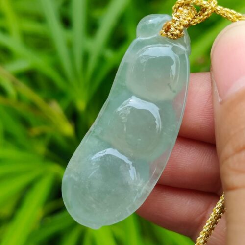 a hand holding a necklace