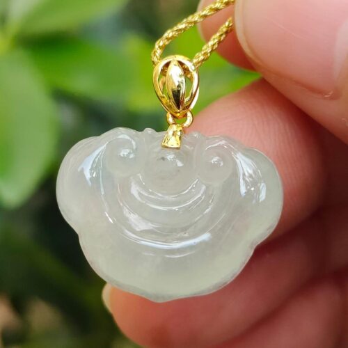 a hand holding a necklace