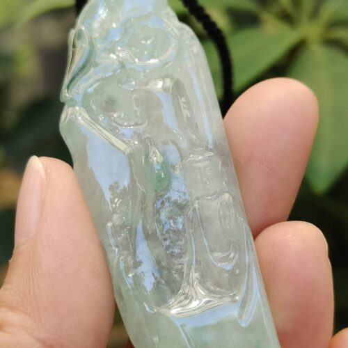 a hand holding a necklace