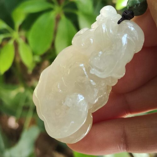 a hand holding a white object