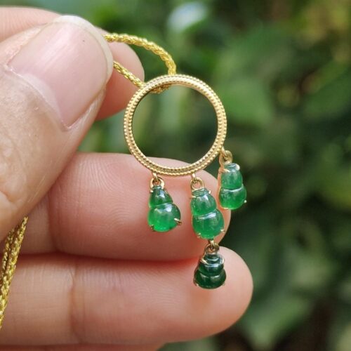 a hand holding a necklace