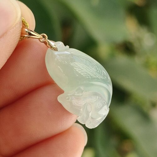 a hand holding a jade pendant - Squirrel Premium Quality with 18k Gold Clasp