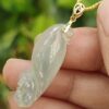 a hand holding a jade pendant - Squirrel Premium Quality with 18k Gold Clasp