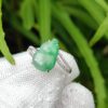 a hand wearing a glove with a ring