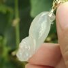 a hand holding a jade pendant - Squirrel Premium Quality with 18k Gold Clasp