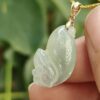 a hand holding a jade pendant - Squirrel Premium Quality with 18k Gold Clasp