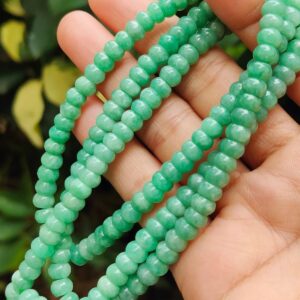 a hand holding a necklace