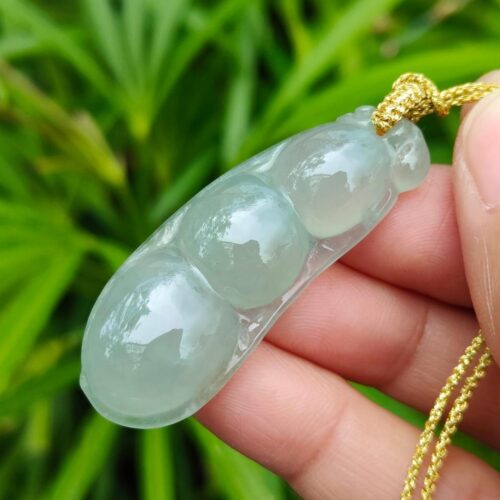 a hand holding a necklace