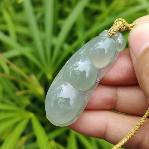 a hand holding a necklace