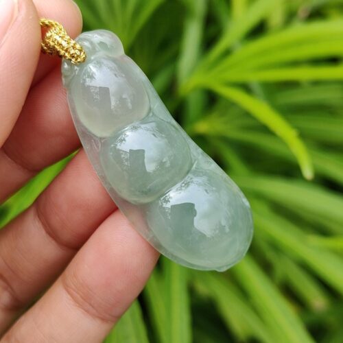 a hand holding a necklace