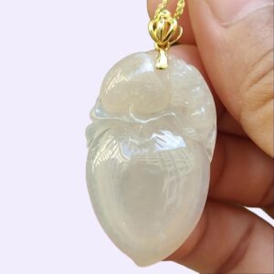 a hand holding a necklace