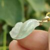 a hand holding a jade pendant - Squirrel Premium Quality with 18k Gold Clasp