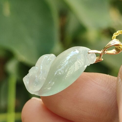 a hand holding a jade pendant - Squirrel Premium Quality with 18k Gold Clasp