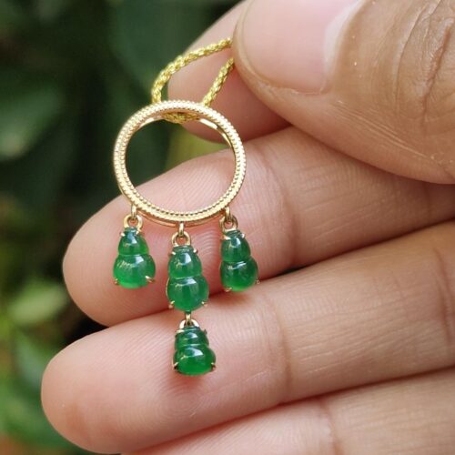 a hand holding a necklace